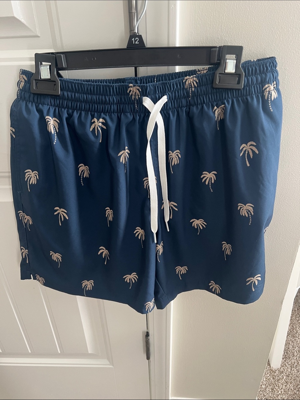 chubbies Navy Swimtrunks with Tan Palm Print and White Drawstring